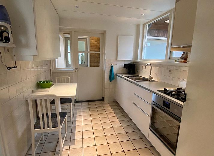 Terrace of VZ920 Holiday home in Cadzand-Bad, Zeeuws-Vlaanderen, ideal for outdoor meals.