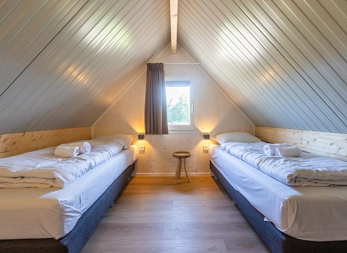 Stijlvolle woonkamer in de Vrijstaande woning in Cadzand, Zeeuws-Vlaanderen, met moderne inrichting en comfortabele zitruimte.