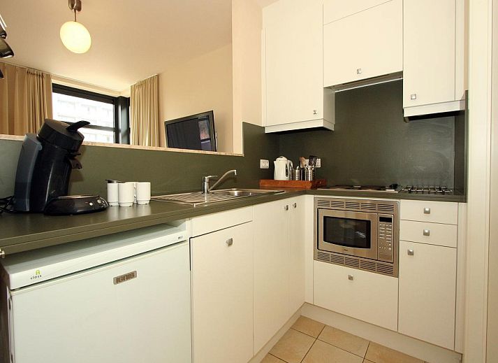 Buitenzijde van vakantiehuis Maanvis in Cadzand, Zeeuws-Vlaanderen met een ruime tuin.