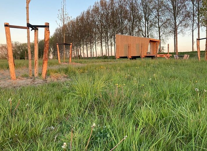 Slaapkamer in Vakantiehuis in Philippine, biedt comfort en uitzicht op de natuur van Zeeuws-Vlaanderen.