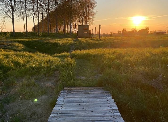 Slaapkamer in Vakantiehuis in Philippine, biedt comfort en uitzicht op de natuur van Zeeuws-Vlaanderen.