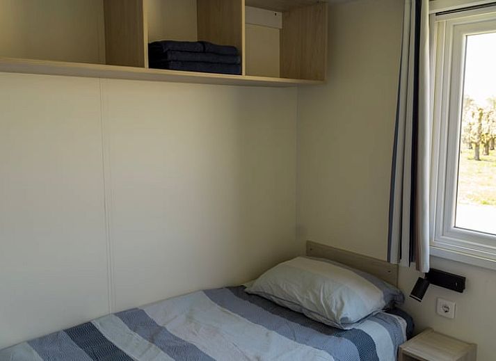 Vakantiehuisje in Hengstdijk, een charmante vakantiewoning in Zeeuws-Vlaanderen met een uitnodigend terras en groene omgeving.