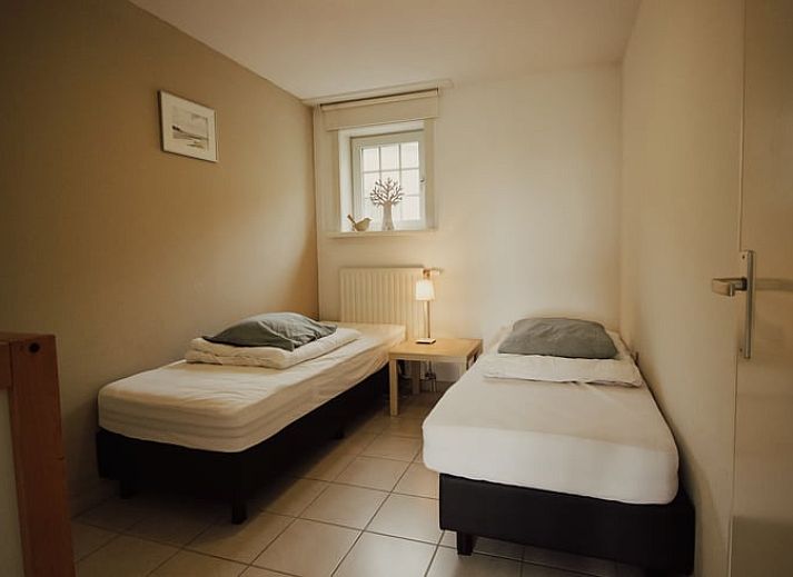 Cozy living room in Holiday Home in Retranchement, Zeeuws-Vlaanderen, with comfortable seating area.