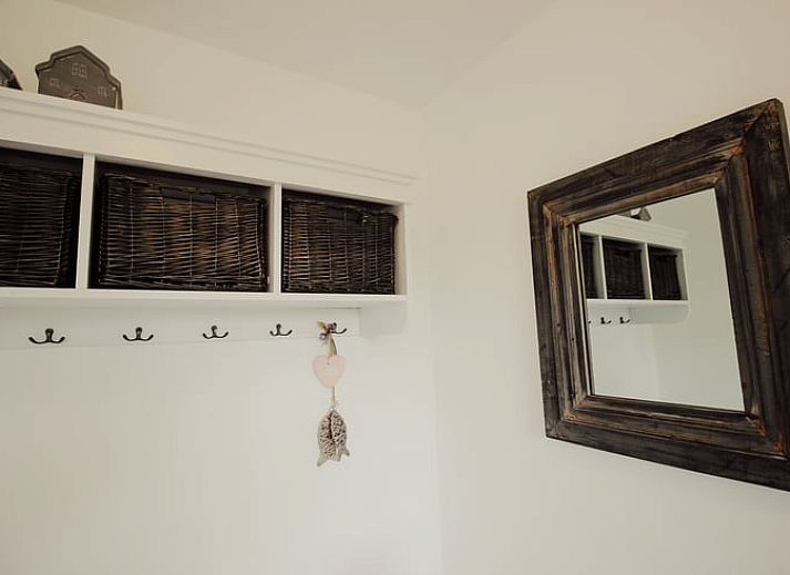 Cozy living room in Holiday Home in Retranchement, Zeeuws-Vlaanderen, with comfortable seating area.