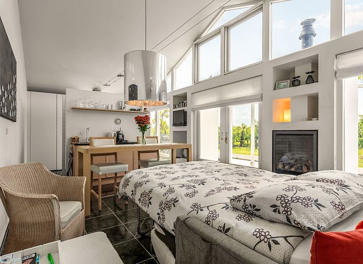 Charming exterior of Holiday Home De Orangerie in Zaamslag, Zeeuws-Vlaanderen, with a cozy patio.