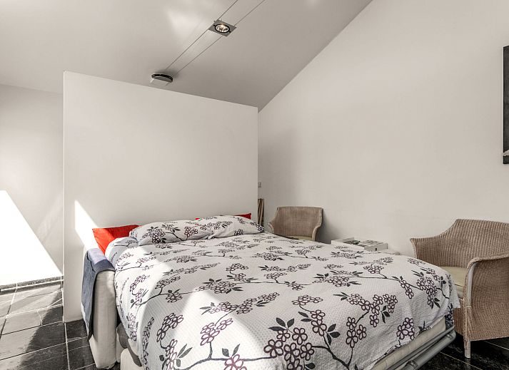 Attractive bedroom with fireplace in Holiday home De Orangerie, Zaamslag, Zeeuws-Vlaanderen, Zeeland.