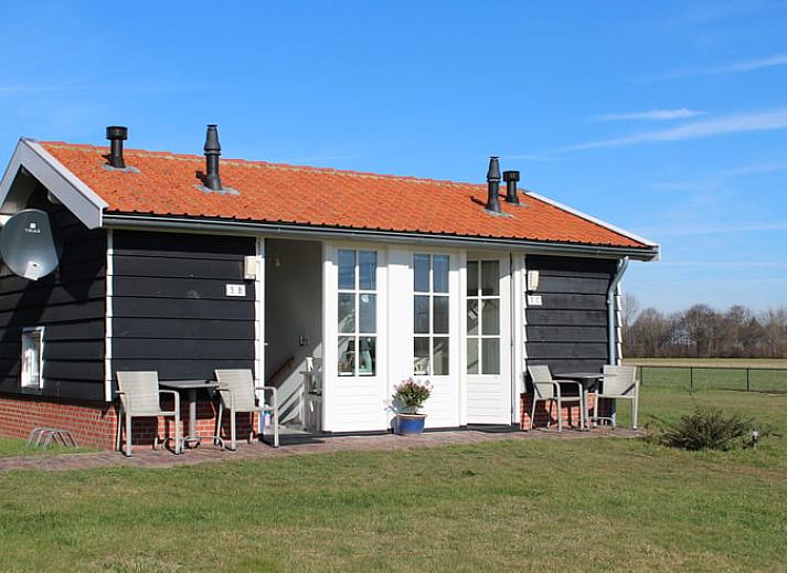 Ferienhaus in Ovezande, Sued-Beveland Ferienhaus mit charmanter Muehle und gruener Umgebung.