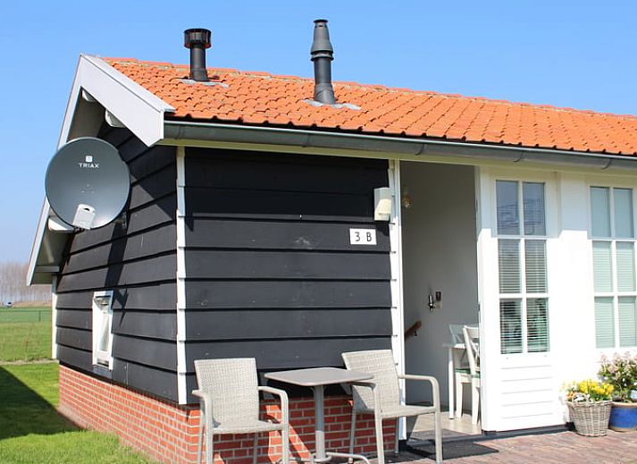 Ferienhaus in Ovezande, Sued-Beveland Ferienhaus mit charmanter Muehle und gruener Umgebung.