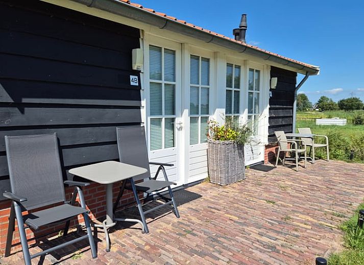 Garten des Ferienhauses in Ovezande, Ferienhaus in Sued-Beveland, mit bunten Blumen und gruener Aussicht.