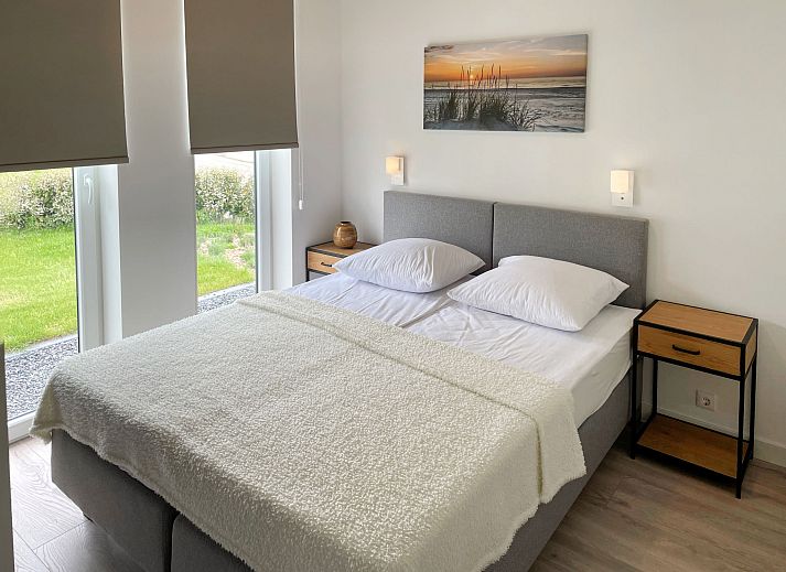 Cozy living room in Holiday home Ruisweg 83, Wemeldinge, overlooking the garden.