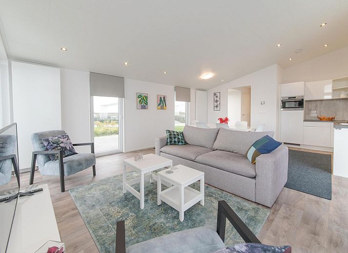 Vacation home Waterresort Oosterschelde - house no. 38 in Wemeldinge with modern exterior and green garden.