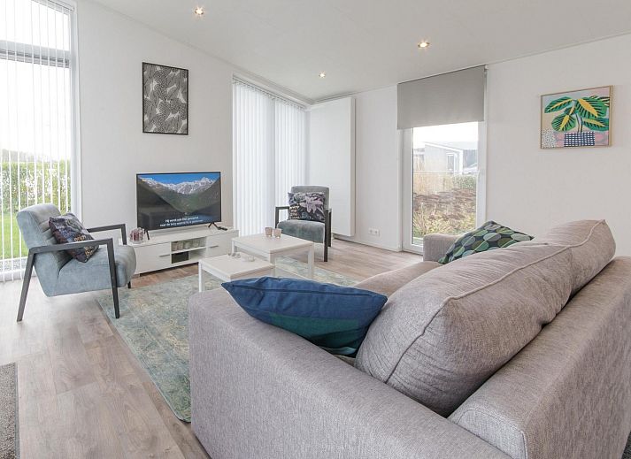 Vacation home Waterresort Oosterschelde - house no. 38 in Wemeldinge with modern exterior and green garden.