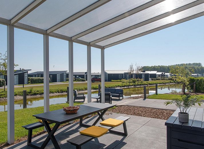 Terrace overlooking the water at Holiday home Waterresort Oosterschelde - house no. 38 in Wemeldinge, Zeeland.