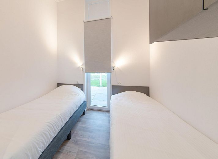 Bright living room of Holiday home Waterresort Oosterschelde - house no. 38 in Wemeldinge with comfortable furniture.