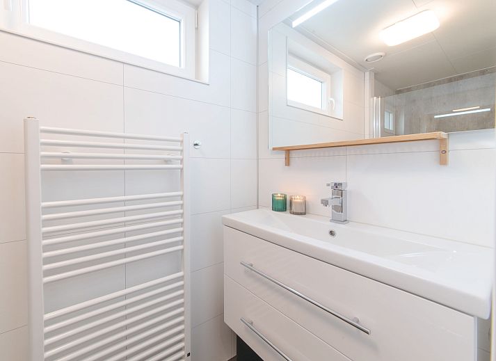 Modern living room in Holiday home Ruisweg 59, Wemeldinge, Zuid-Beveland with comfortable seating area.