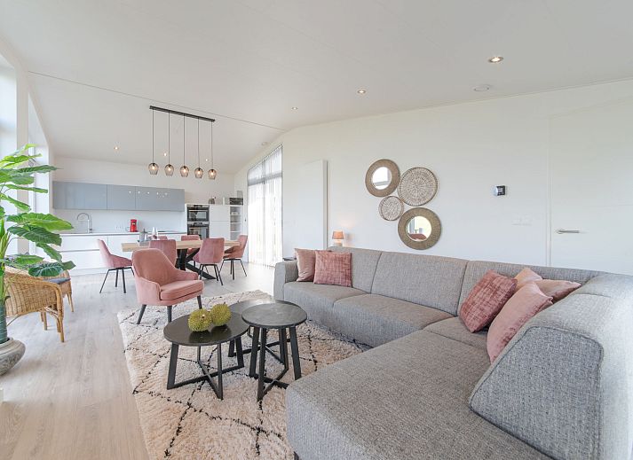 Modern living room in Holiday home Ruisweg 59, Wemeldinge, Zuid-Beveland with comfortable seating area.