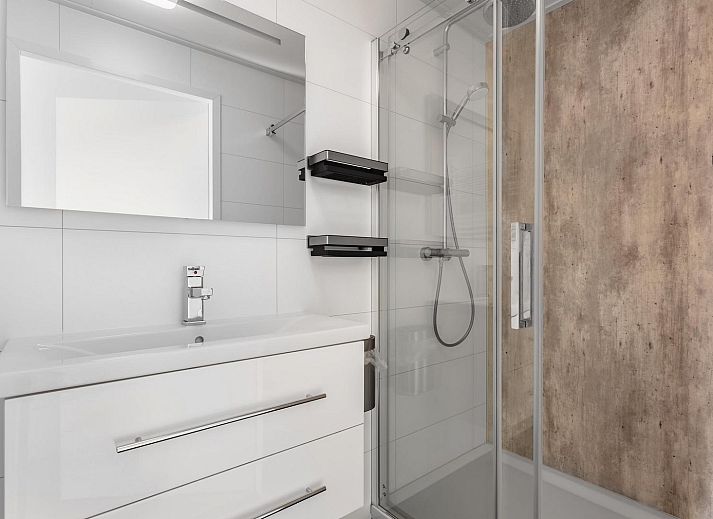 Stylish living room in Holiday home Waterresort Oosterschelde, house no. 80 in Wemeldinge, South Beveland with modern furnishings.