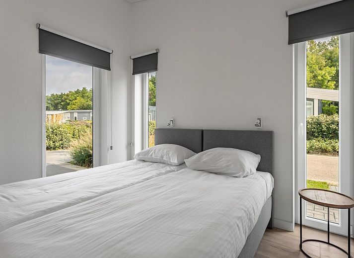 Stylish living room in Holiday home Waterresort Oosterschelde, house no. 80 in Wemeldinge, South Beveland with modern furnishings.