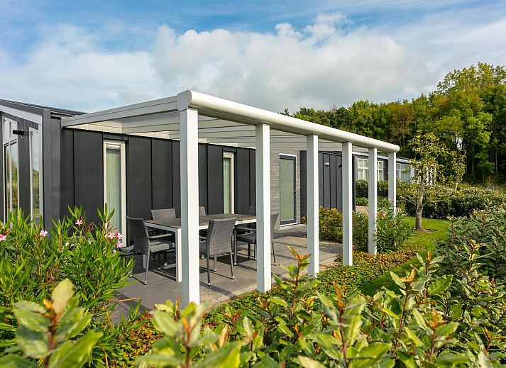 Bright living room with open kitchen in Holiday home Waterresort Oosterschelde, house no. 80 in Wemeldinge, South Beveland.
