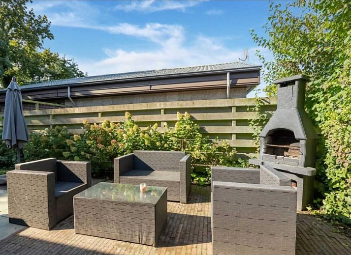 Cozy living room in vacation home Scheldeoord 54, Baarland, South Beveland, with comfortable seating area and natural light.