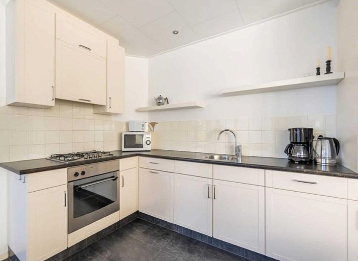 Cozy living room in vacation home Scheldeoord 54, Baarland, South Beveland, with comfortable seating area and natural light.