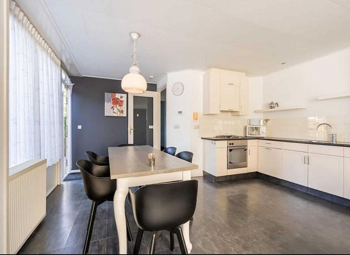 Cozy living room in vacation home Scheldeoord 54, Baarland, South Beveland, with comfortable seating area and natural light.