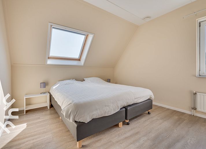 Spacious bedroom with multiple beds in vacation home ZE250 in Goes, Zeeland.