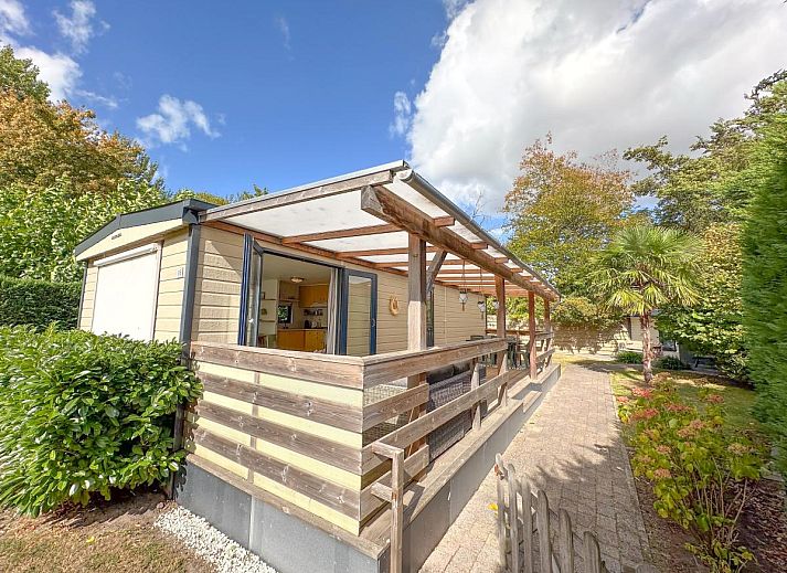 Vakantiehuis Timmerman in Heinkenszand, Zuid-Beveland, met ruime veranda en groene tuin omgeven door natuur.