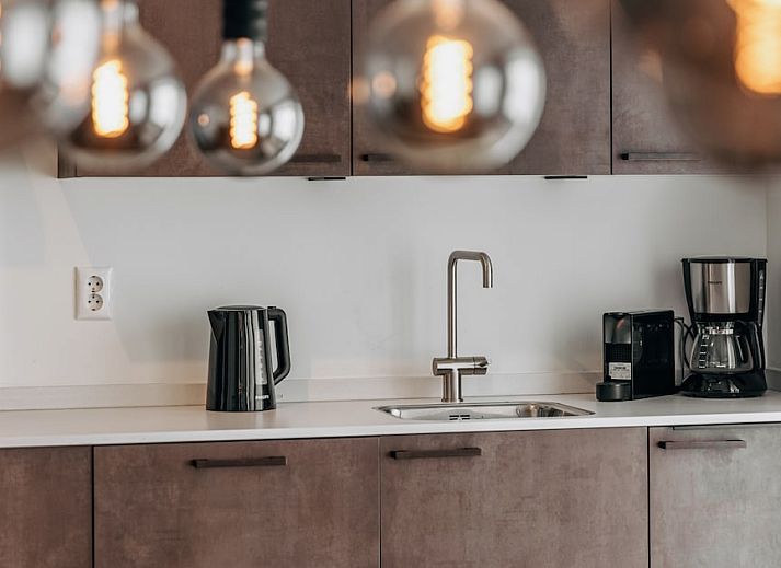 Modern living room of Luxury Villa 10 in Wolphaartsdijk, South Beveland, with comfortable sitting area and stylish dining area in vacation home.