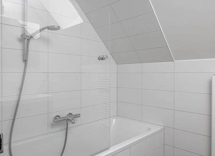 Modern living room of Luxury Villa 10 in Wolphaartsdijk, South Beveland, with comfortable sitting area and stylish dining area in vacation home.