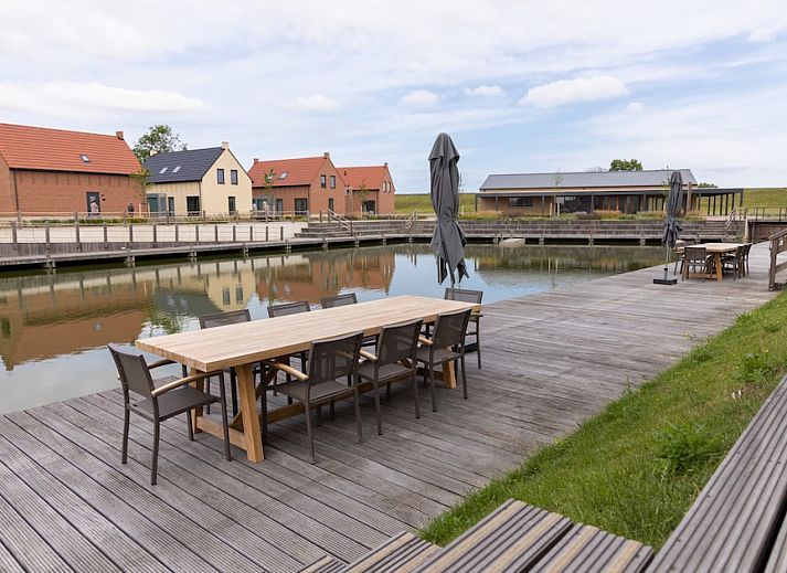 Stylish sitting area in Luxury Villa 10, vacation home in Wolphaartsdijk, South Beveland, Zeeland with modern decor and natural light.
