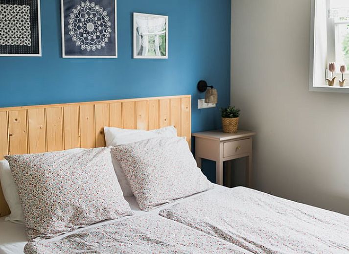 Zijaanzicht van Vakantiehuis in Lewedorp, Zuid-Beveland met karakteristieke bakstenen gevel.