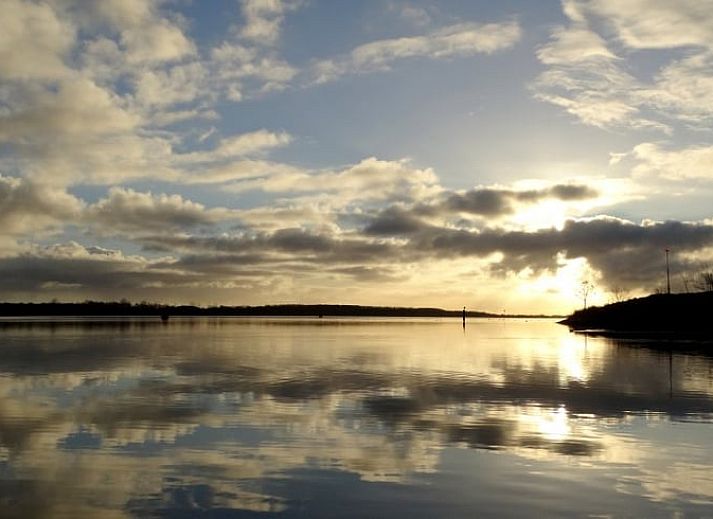 Modern living room of Cottage in Lewedorp with comfortable seating area in South Beveland, Zeeland.