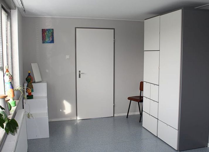 Modern living room of Cottage in Lewedorp with comfortable seating area in South Beveland, Zeeland.