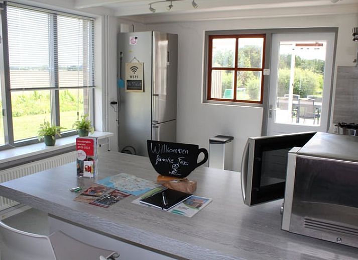 Modern living room of Cottage in Lewedorp with comfortable seating area in South Beveland, Zeeland.