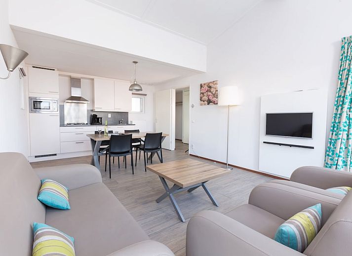 Stylish living room of Bungalow 4B in Ouddorp, Goeree-Overflakkee, South Holland with modern interior and lots of natural light.