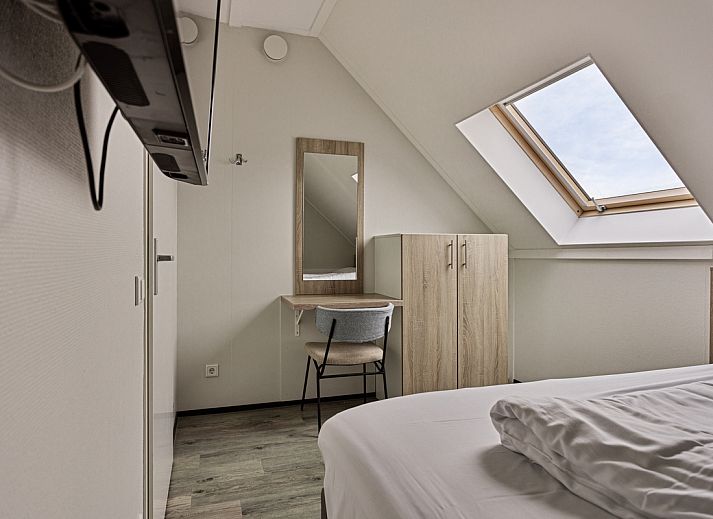 Gemtliches Wohnzimmer in Geschakelde woning in Ouddorp, Ferienhaus mit Blick auf die Natur in Ouddorp, Goeree-Overflakkee, Sdholland.