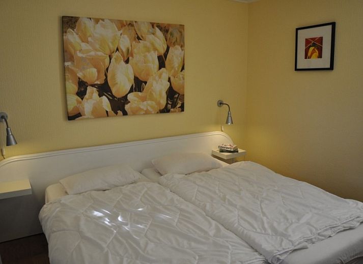 Collage van Vakantiehuis Ouddorp, met strandhuis thema en interieur in Goeree-Overflakkee.