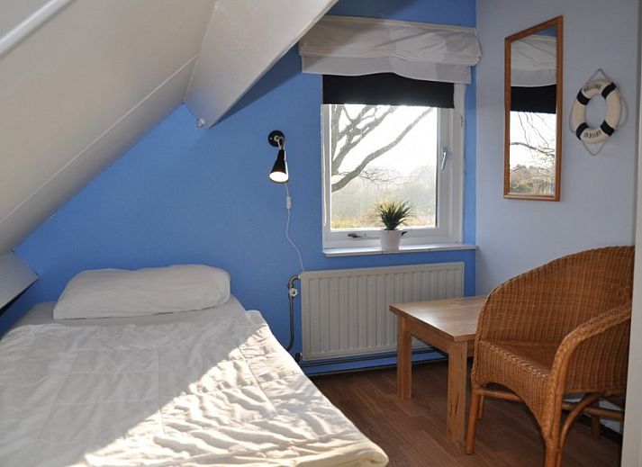 Collage van Vakantiehuis Ouddorp, met strandhuis thema en interieur in Goeree-Overflakkee.