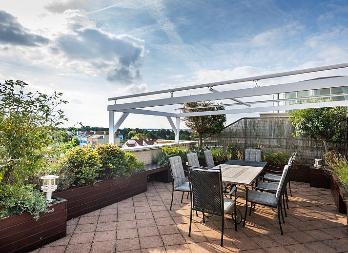 Woonkamer van Penthouse Appartement Marina Port Zelande in Ouddorp, met comfortabele banken in Goeree-Overflakkee, Zuid-Holland.