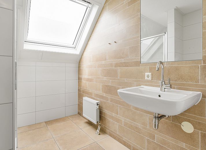 Cozy sitting area in Strand Resort Ouddorp Duin, 10-person villa in Ouddorp, South Holland.