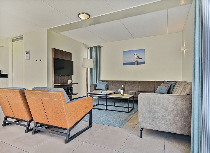 Comfortable living room with corner sofa in Strand Resort Ouddorp Duin, vacation home in Ouddorp.