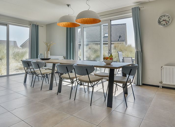 Stylish coffee table with wine in Strand Resort Ouddorp Duin, 10-person villa in Ouddorp.