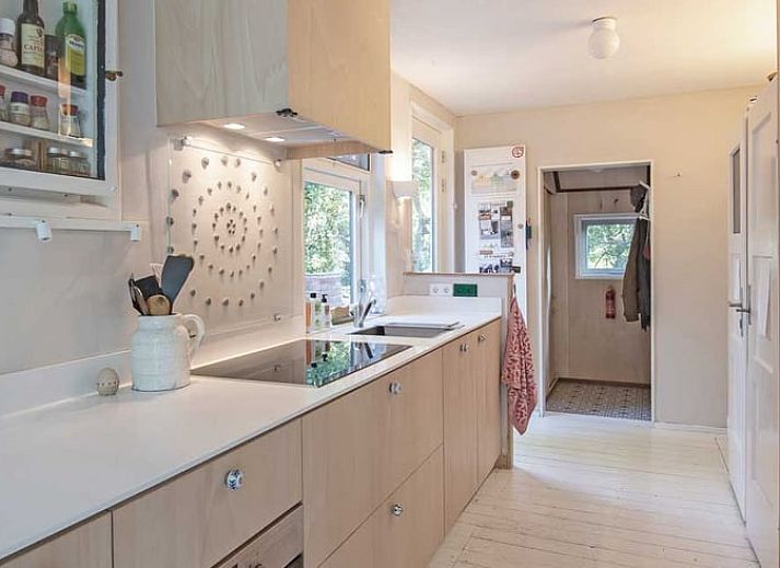 Cozy living room with wood stove in Holiday home in Ouddorp, South Holland.