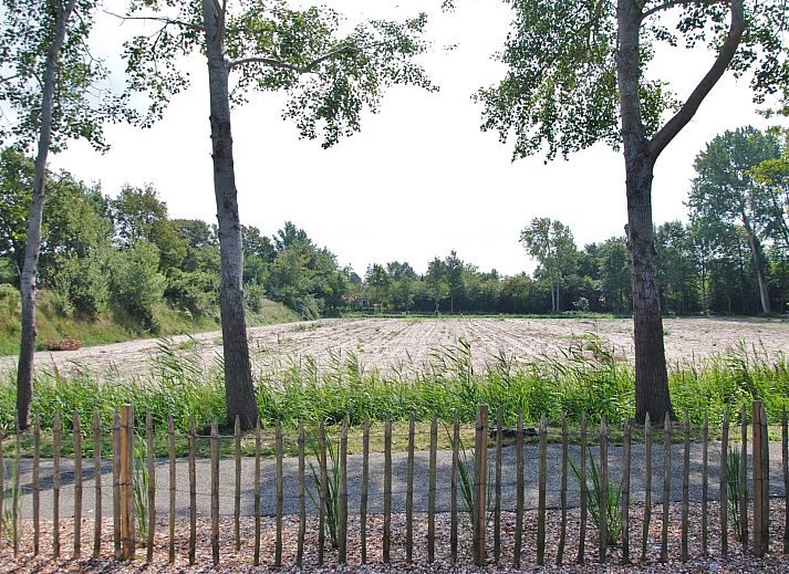 Gemuetliches Wohnzimmer im Ferienhaus De Toekomst 126 Beachgarden in Ouddorp mit stilvoller Einrichtung.