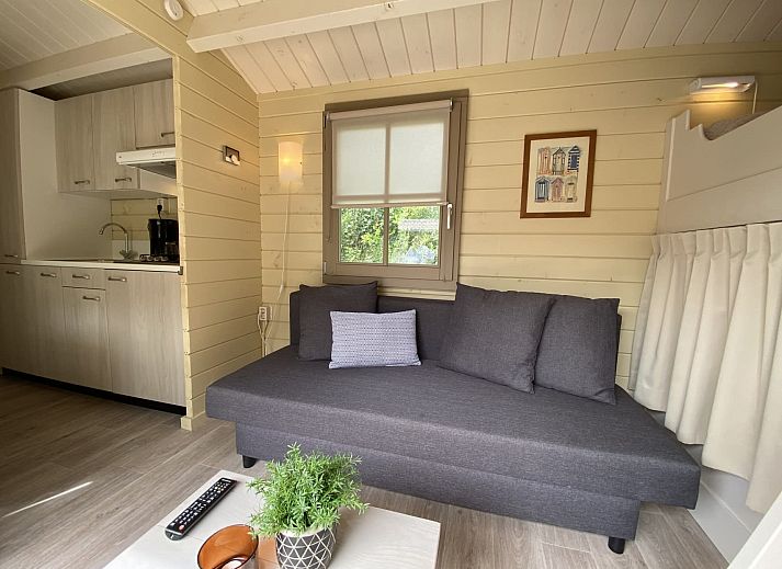 Camping chalet the Albatros Plus in Ouddorp, Goeree-Overflakkee, South Holland with spacious veranda and green surroundings.