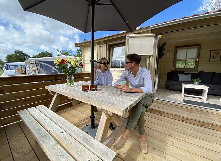 Enjoy the sun on the veranda of Camping Chalet the Albatros Plus in Ouddorp, Goeree-Overflakkee, South Holland.
