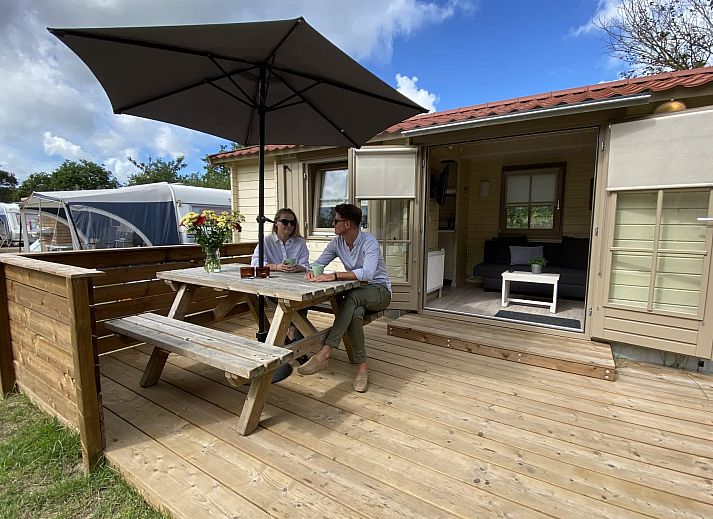 Enjoy the sun on the veranda of Camping Chalet the Albatros Plus in Ouddorp, Goeree-Overflakkee, South Holland.