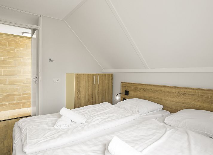 Gemuetliches Wohnzimmer im Strand Resort Ouddorp Duin, 6-Personen-Villa Zeeduin, Ouddorp. Gemuetliche Sitzecke mit Blick auf die Duenen.