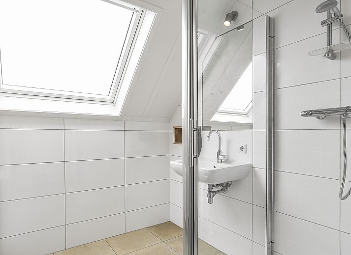 Gezellige zithoek in de villa van Strand Resort Ouddorp Duin, Zuid-Holland.